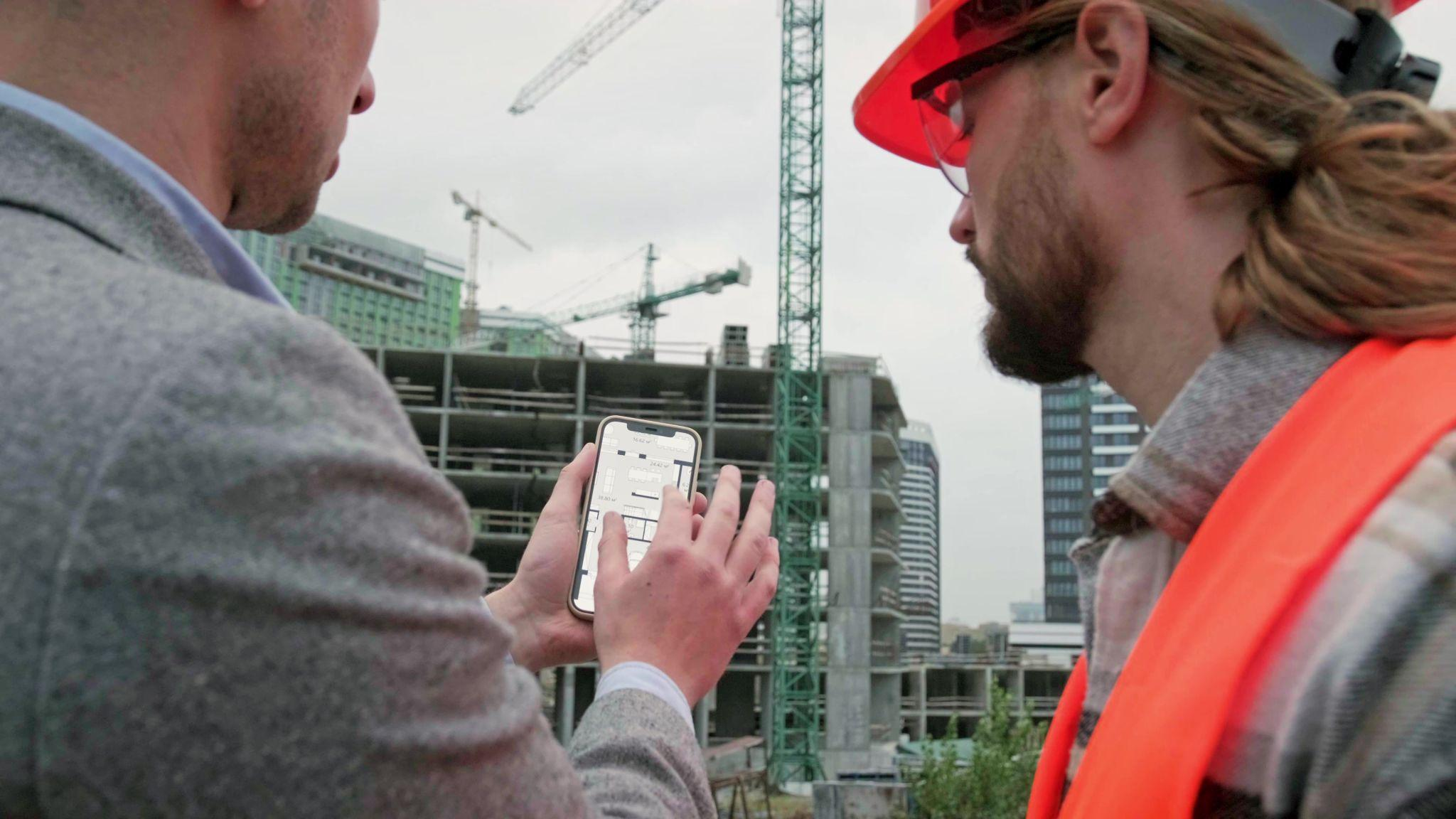 Construction manager evaluating IT systems