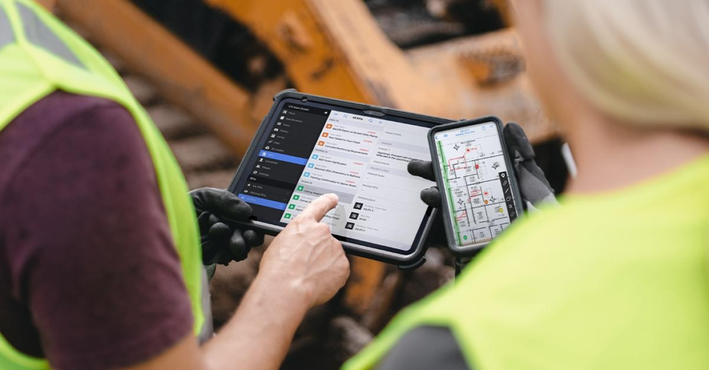 Construction team accessing cloud-based project files on a jobsite