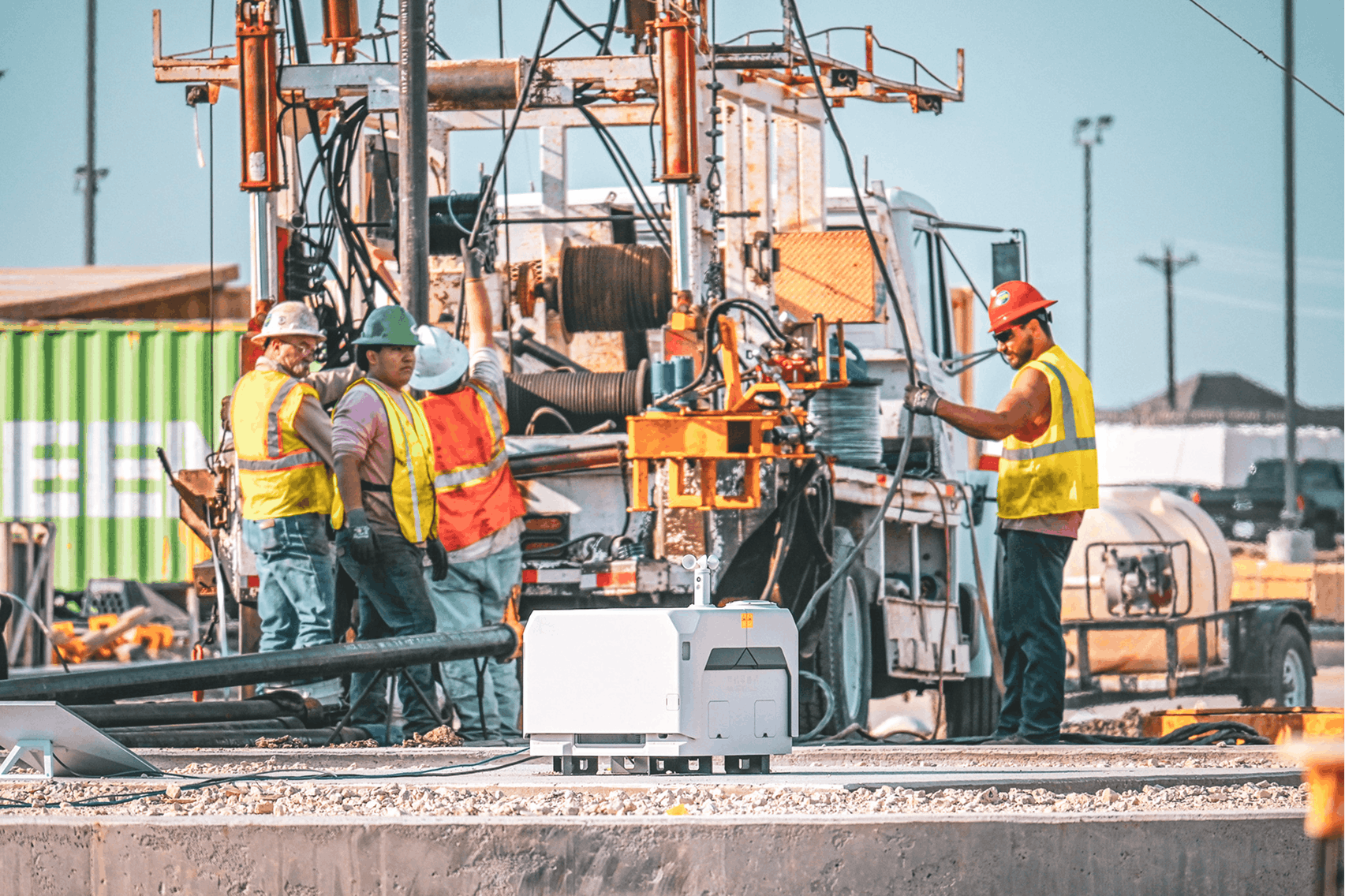 Construction teams coordinating across multiple jobsites using technology