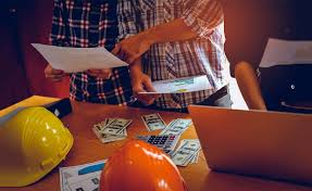 Construction executive reviewing unexpected operational costs